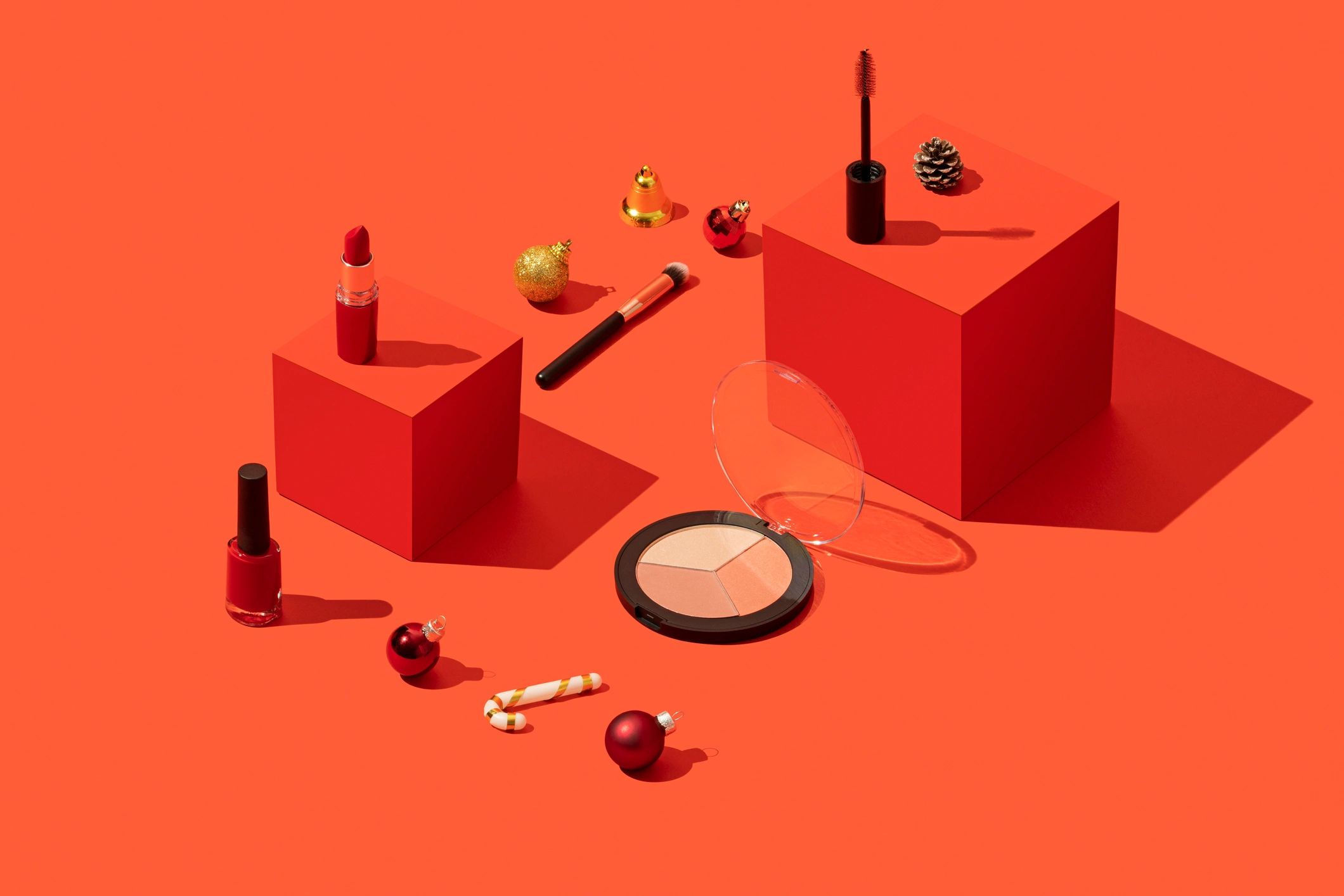 Styled product photography setup featuring cosmetics
