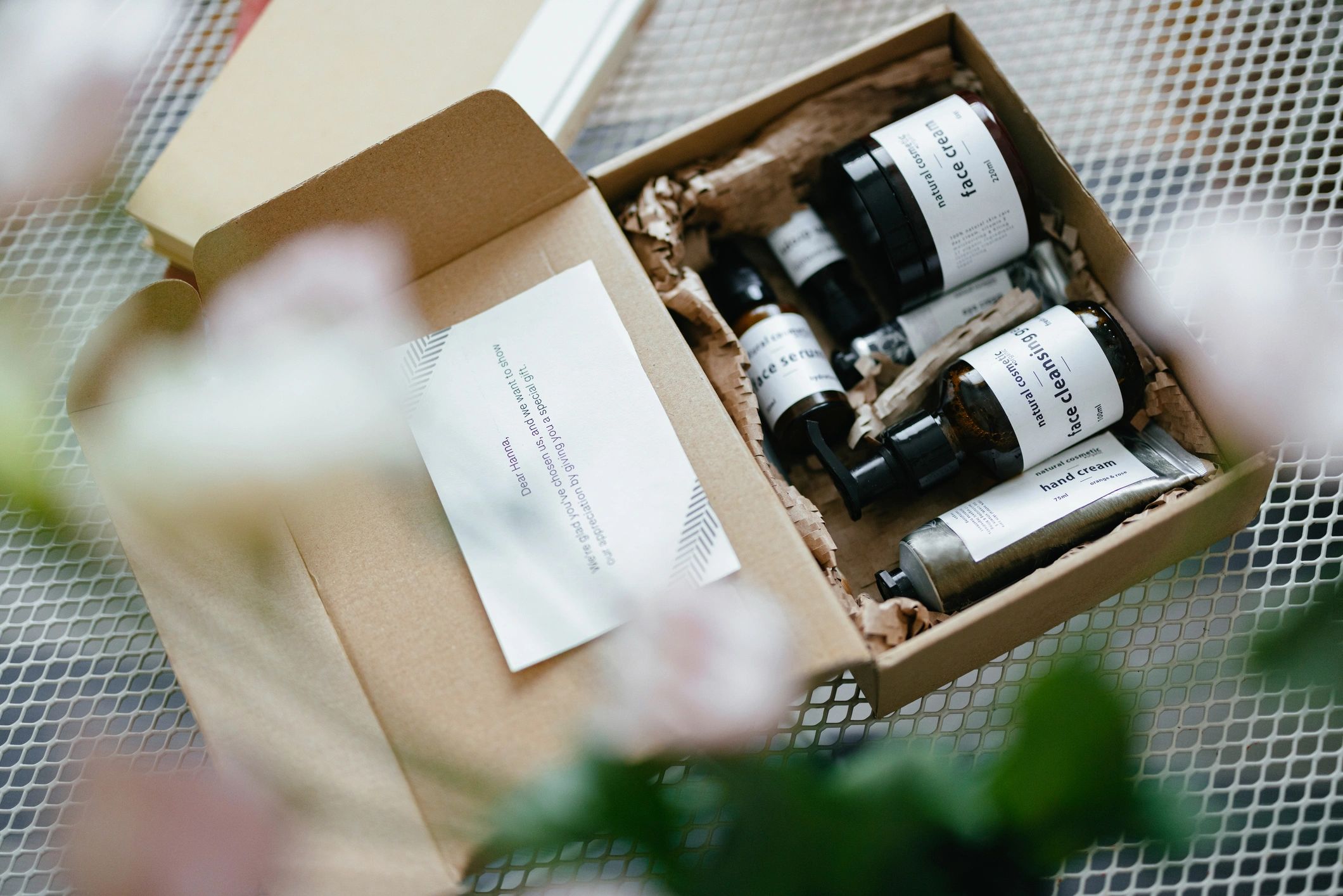 Natural cosmetic products styled in a gift box with copy space