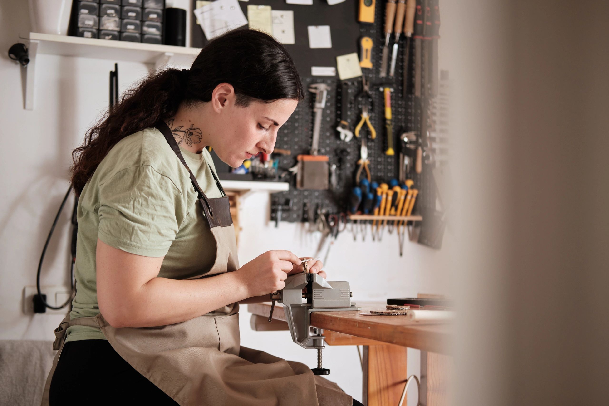Creative artisan working carefully in a studio workshop
